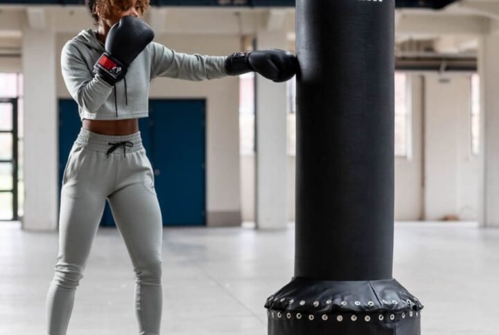 Women boxer jabbing the VirtuFit Free Standing Punchbag from the side